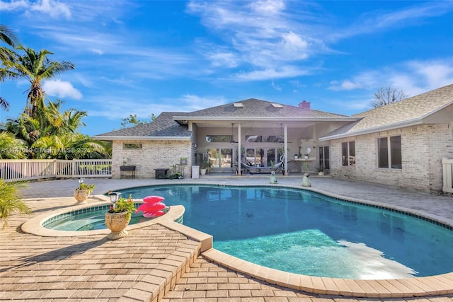 view of swimming pool featuring a patio area