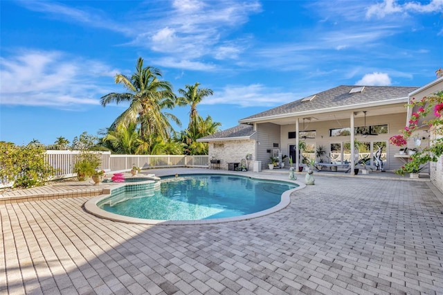 view of swimming pool featuring a patio and ceiling fan