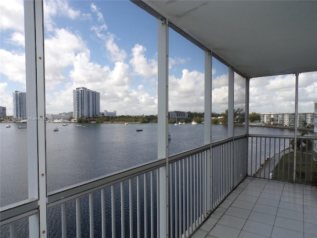 unfurnished sunroom with a water view