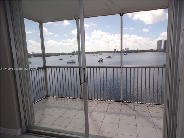 unfurnished sunroom with a water view and plenty of natural light