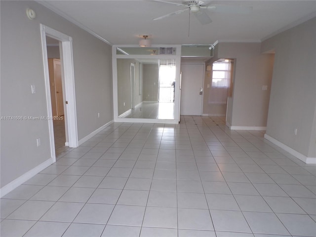 tiled empty room with crown molding and ceiling fan