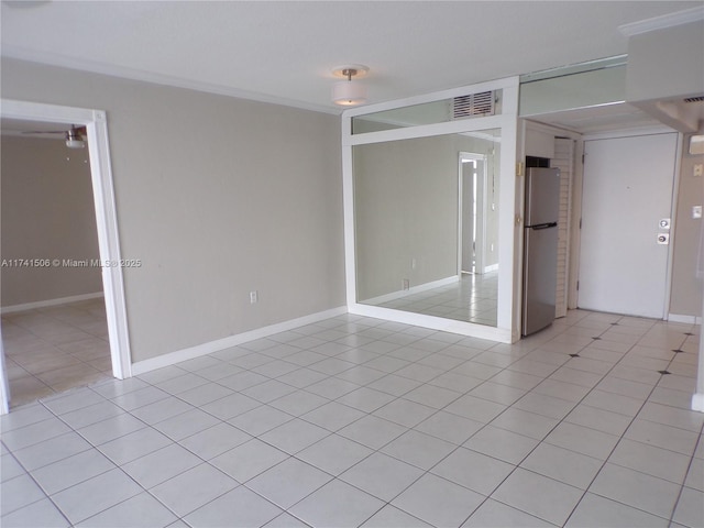 empty room featuring light tile patterned floors