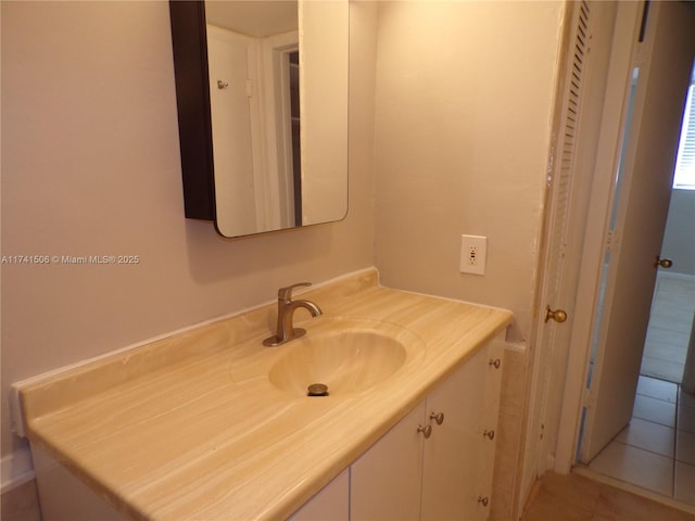 bathroom with vanity and tile patterned floors