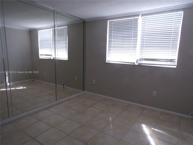 unfurnished bedroom with tile patterned flooring