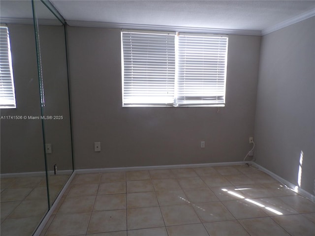 tiled empty room with ornamental molding