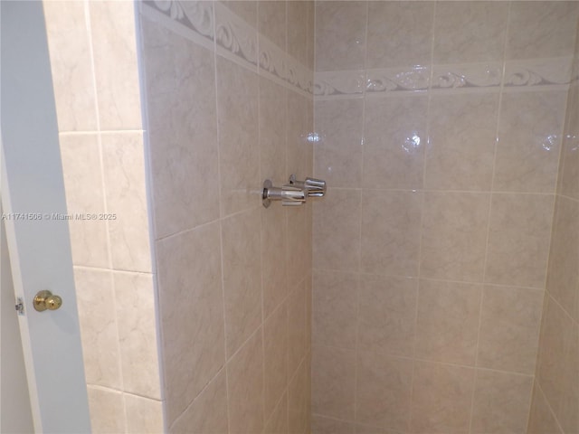 bathroom with tiled shower