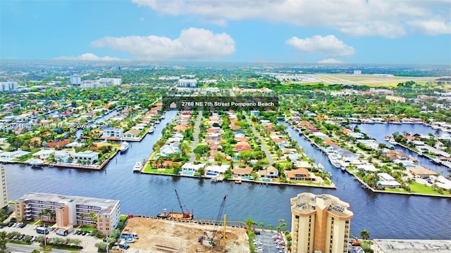 drone / aerial view with a view of city and a water view