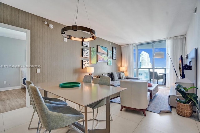 dining room featuring floor to ceiling windows