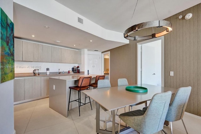 tiled dining area with wooden walls