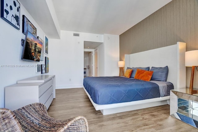 bedroom featuring light hardwood / wood-style floors