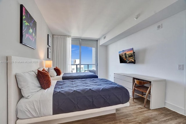 bedroom featuring wood-type flooring