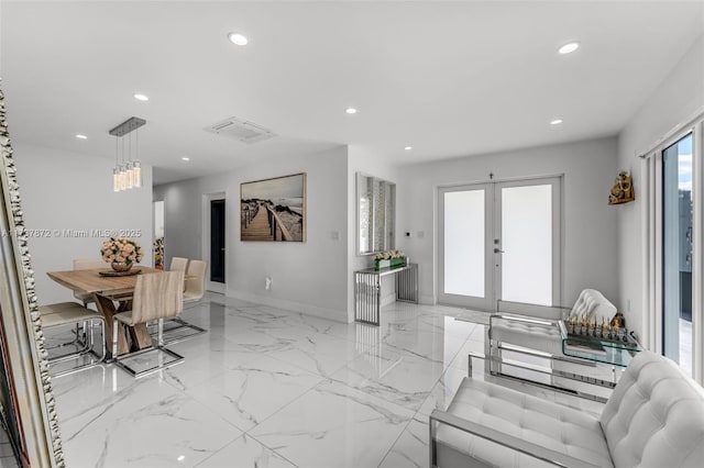 dining space with marble finish floor, recessed lighting, baseboards, and french doors