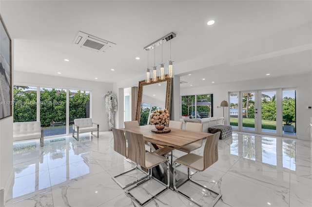 dining space with marble finish floor, french doors, and plenty of natural light