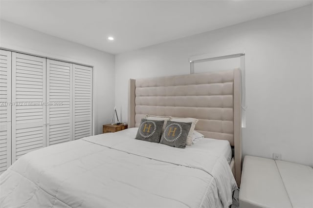 bedroom with a closet and recessed lighting