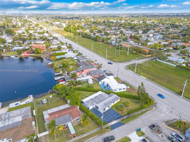 bird's eye view with a residential view and a water view