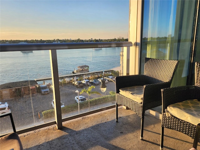 balcony at dusk with a water view