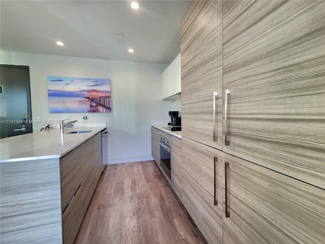 777 N Ocean Dr Unit S401, Hollywood, FL 33019 - kitchen featuring recessed lighting, light countertops, modern cabinets, appliances with stainless steel finishes, and a sink
