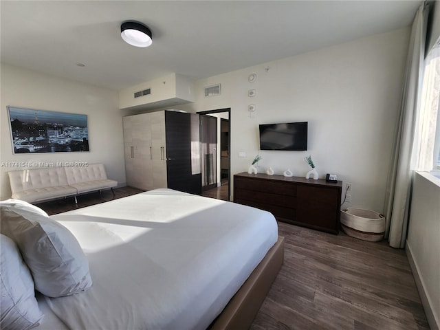 bedroom featuring dark wood-type flooring