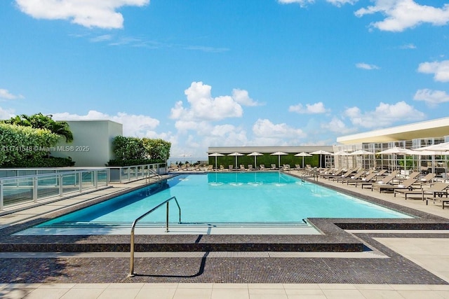 view of swimming pool with a patio