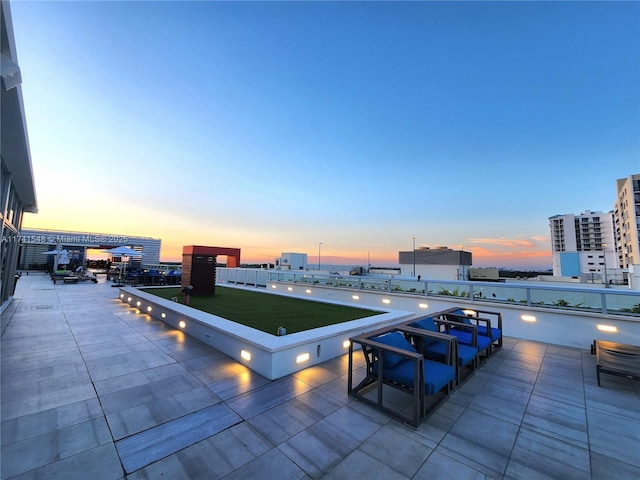 view of patio terrace at dusk