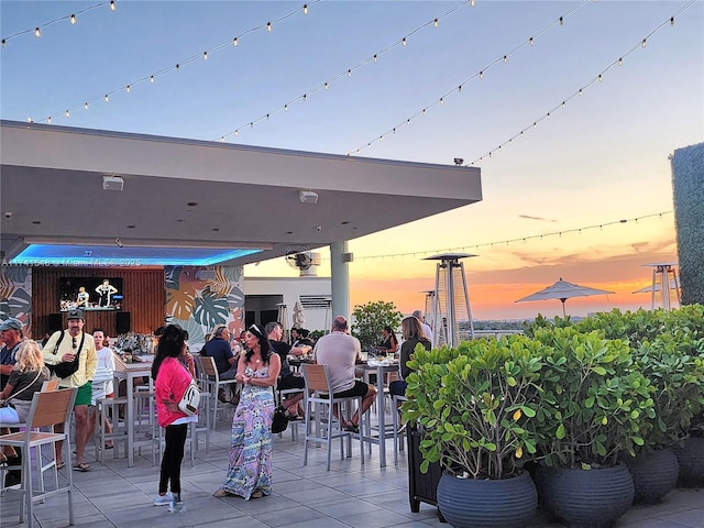 view of patio terrace at dusk