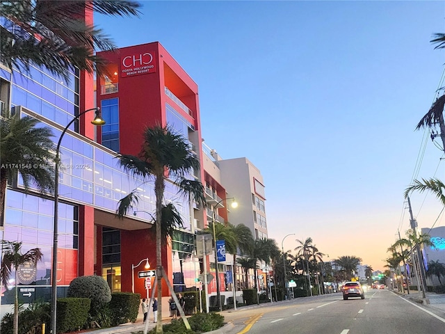 view of outdoor building at dusk