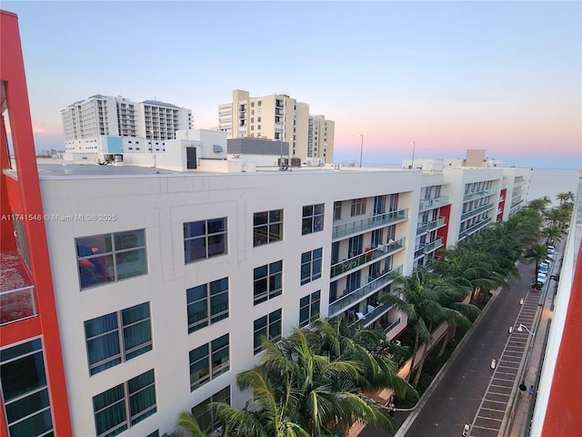 view of outdoor building at dusk