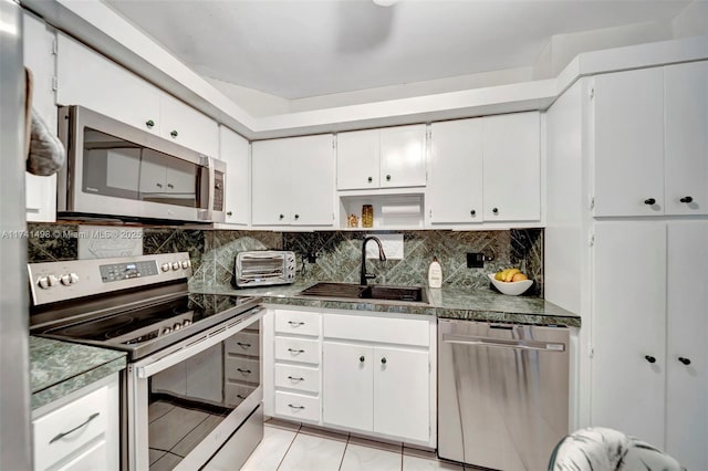 1985 S Ocean Dr Unit 22G, Hallandale Beach, FL 33009 - kitchen featuring white cabinetry, sink, tasteful backsplash, and appliances with stainless steel finishes