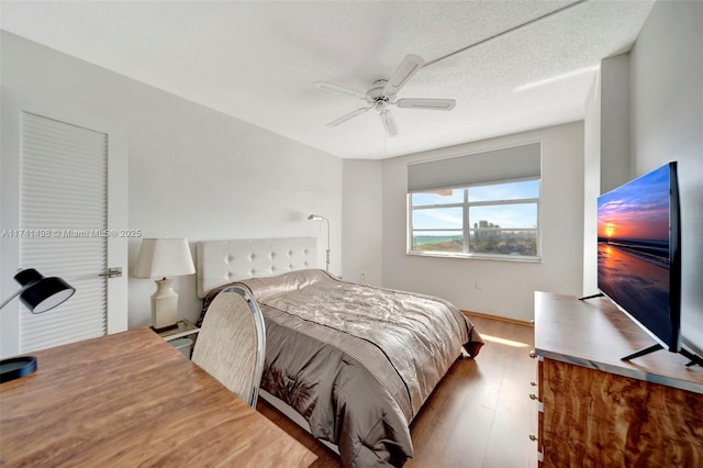 1985 S Ocean Dr Unit 22G, Hallandale Beach, FL 33009 - bedroom with ceiling fan, hardwood / wood-style floors, and a textured ceiling