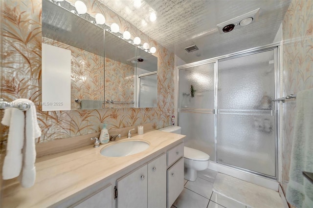 1985 S Ocean Dr Unit 22G, Hallandale Beach, FL 33009 - bathroom featuring vanity, an enclosed shower, tile patterned floors, and toilet