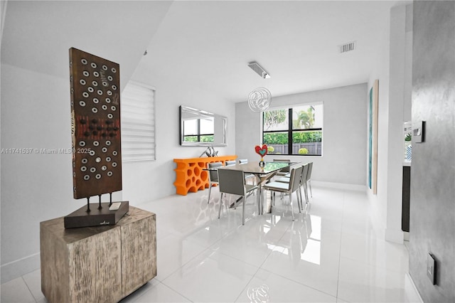 dining space with light tile patterned floors