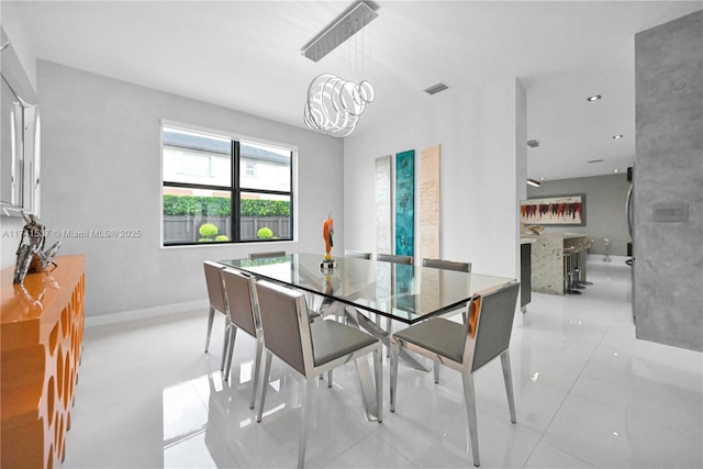 dining space with a notable chandelier