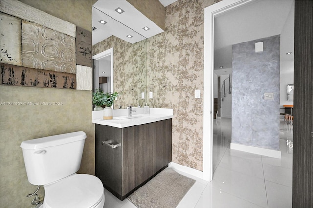 bathroom featuring tile patterned floors, toilet, and vanity