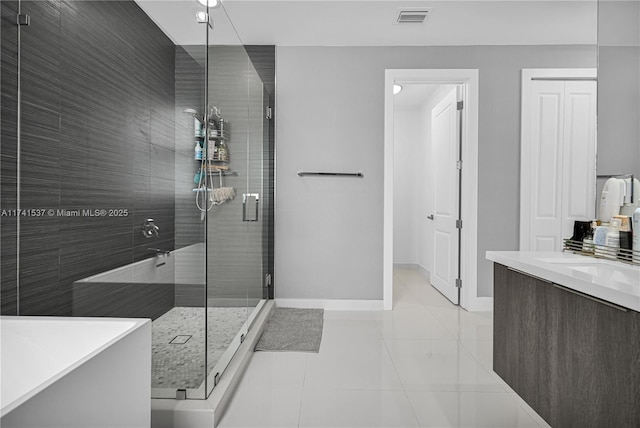 bathroom featuring vanity, tile patterned floors, and independent shower and bath