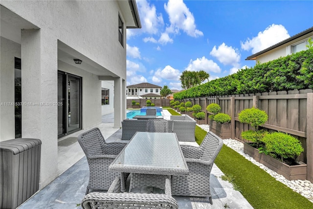 view of patio featuring a fenced in pool