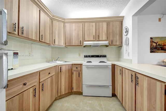 kitchen with electric stove, sink, light tile patterned floors, a textured ceiling, and light brown cabinetry