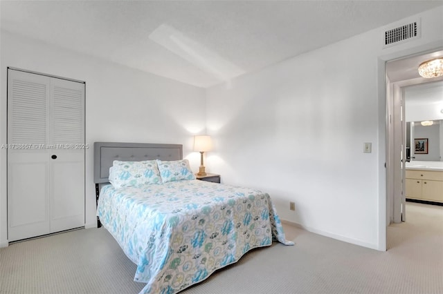 carpeted bedroom featuring a closet