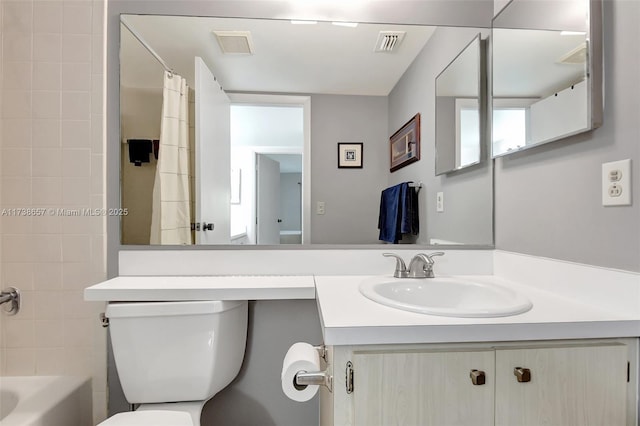 full bathroom with vanity, shower / bath combo, and toilet