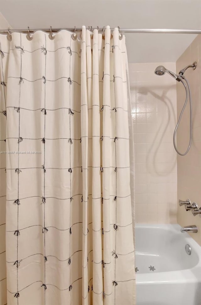 bathroom featuring shower / bath combination with curtain