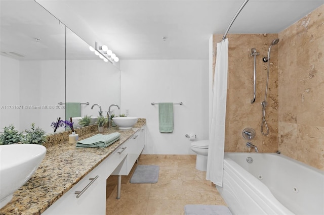 full bathroom with vanity, shower / tub combo, and toilet