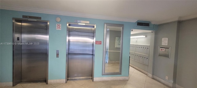 interior space with crown molding, elevator, and mail boxes