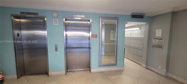 interior space featuring ornamental molding, elevator, and mail boxes