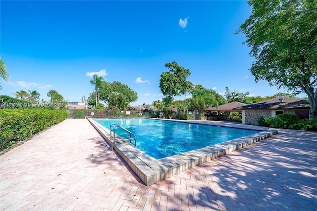 view of pool featuring a patio