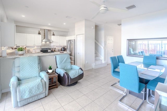 tiled living room featuring ceiling fan