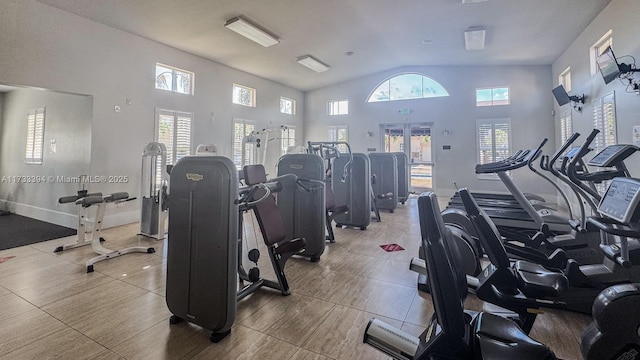 gym featuring high vaulted ceiling