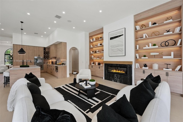 living room featuring sink and built in features