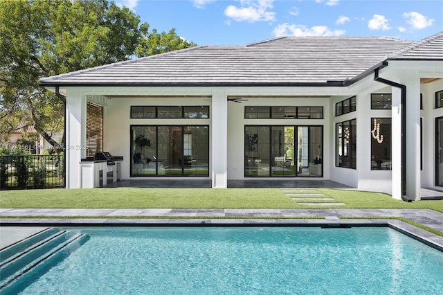 back of property featuring area for grilling, a yard, a patio area, and ceiling fan