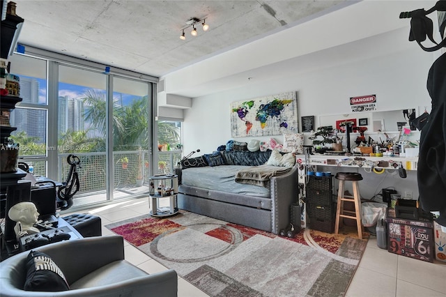 tiled living room with a wall of windows