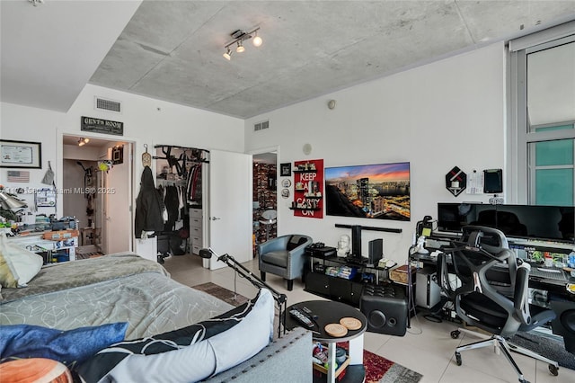 bedroom featuring light tile patterned floors