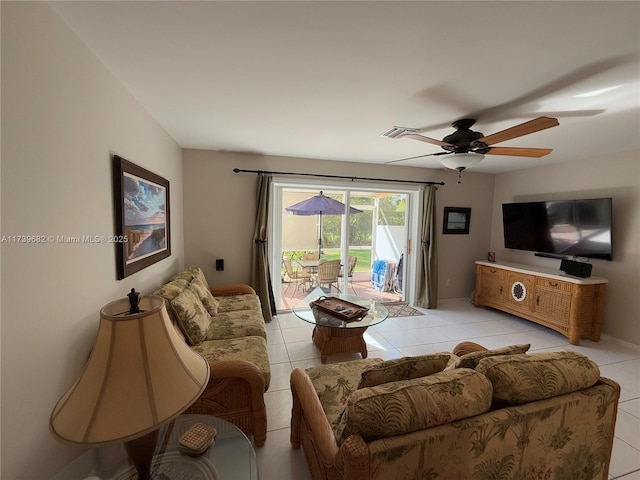 living room with light tile patterned flooring and ceiling fan